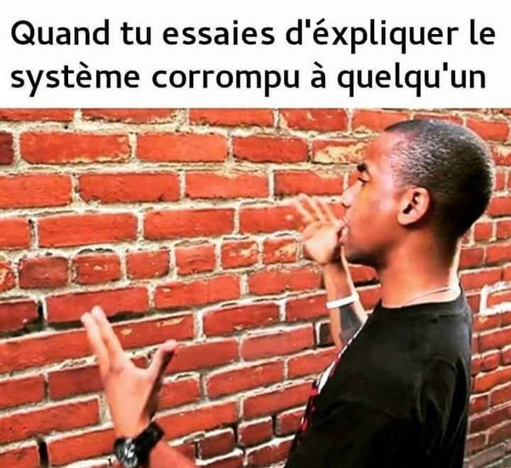 Caricature   homme qui cause à un mur   quand tu essaie d'éxpliquer le système corrompu à quelqu'un